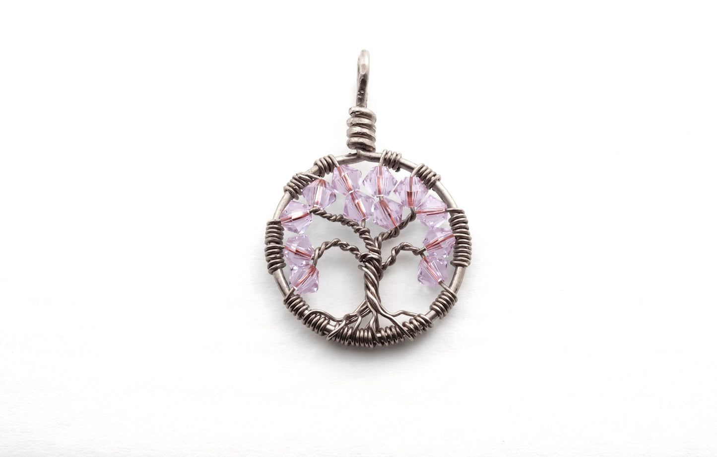 An image of the June birthstone tree of life pendant from Uncorked & Bottled Up made with Alexandrite Swarovski crystals and silver wire