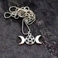 A close up image of the triple goddess pentagram necklace from Uncorked & Bottled Up